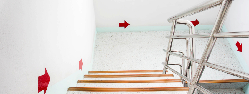 Building Compliance vs. Building Complaints (clearly marked fire exits)