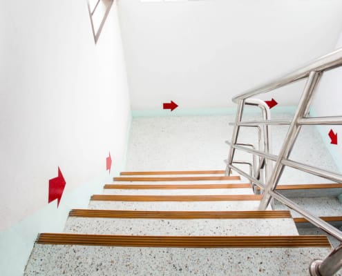 Building Compliance vs. Building Complaints (clearly marked fire exits)