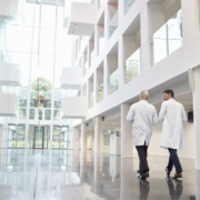 employees walking in a healthcare building with sound and communication systems