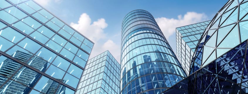 Modern style hi rise blue glass building exterior with sunny blue sky background 3d render for future business headquarter digital smart city concept