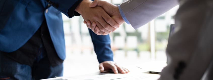 Business partner handshake after the meeting. Financial and investment cooperation.