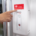 fire alarm system panel in commercial building hallway emergency lighting sprinkler system