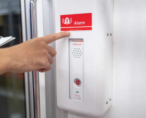 fire alarm system panel in commercial building hallway emergency lighting sprinkler system