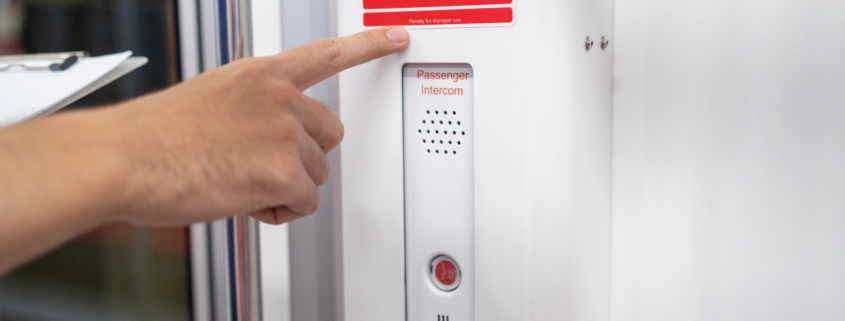 fire alarm system panel in commercial building hallway emergency lighting sprinkler system
