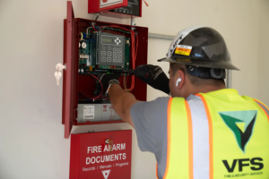 Commercial fire alarm system inspection by VFS Fire & Security Services technician in Tustin, CA